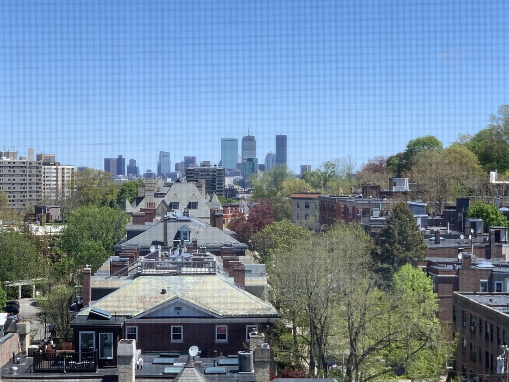 1731 Beacon Street, Unit 1213 Brookline, MA 02445 - Photo 10 of 29 a view of a building with outdoor space and sitting area