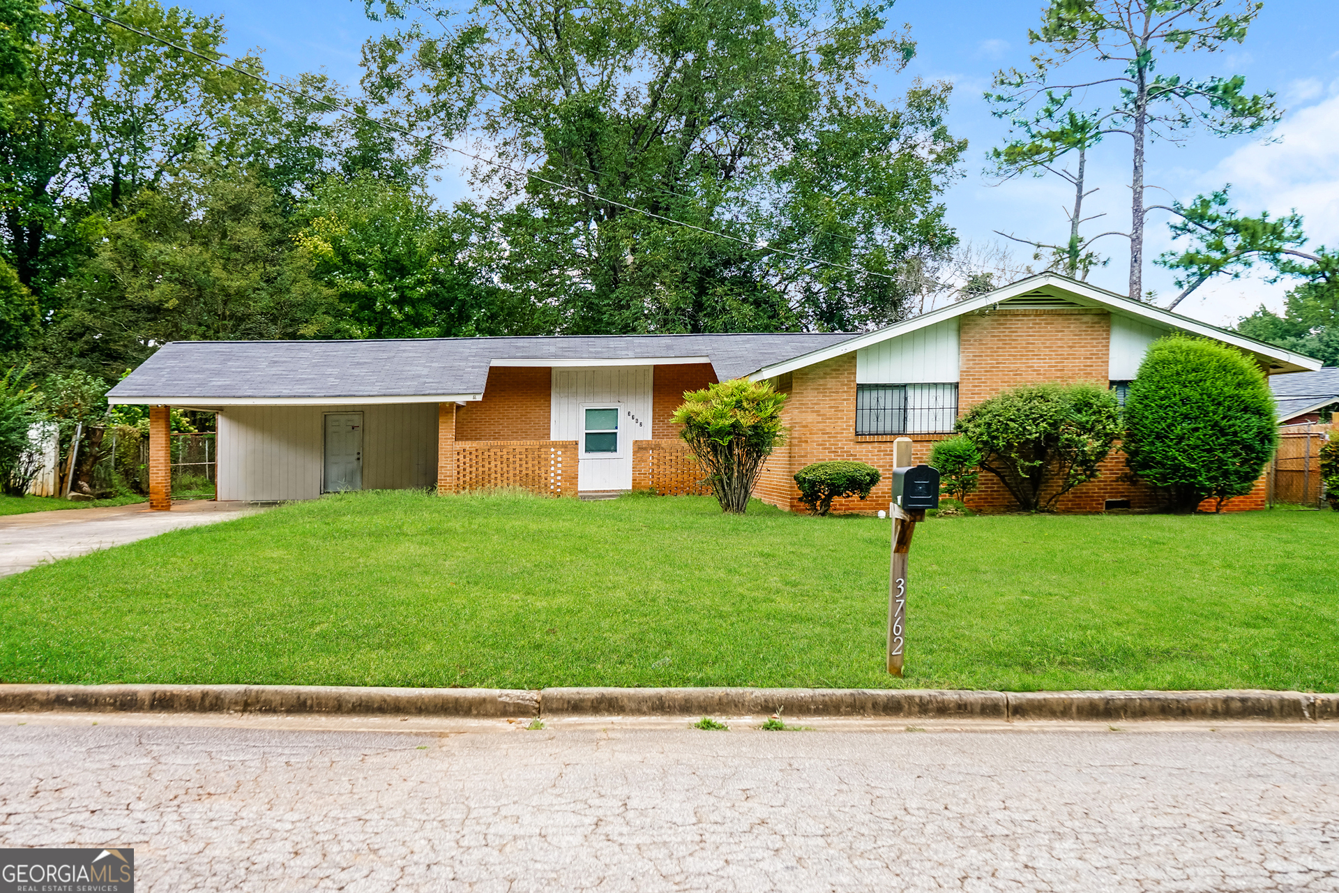 a view of a yard in front view of a house