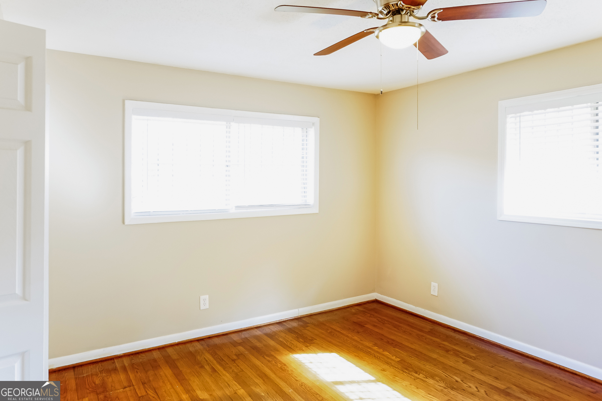 3762 Elkridge Drive Decatur, GA 30032 - Photo 11 of 16 an empty room with a window and ceiling fan