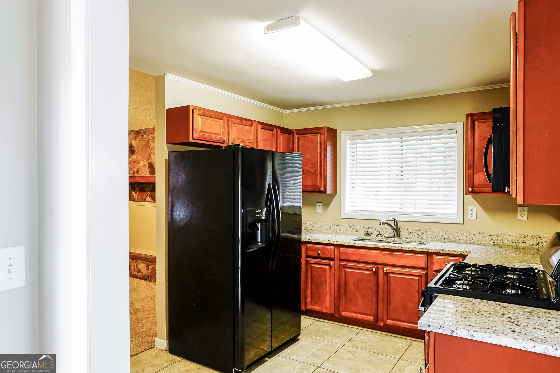 3762 Elkridge Drive Decatur, GA 30032 - Photo 5 of 16 a kitchen with stainless steel appliances granite countertop a refrigerator and a sink