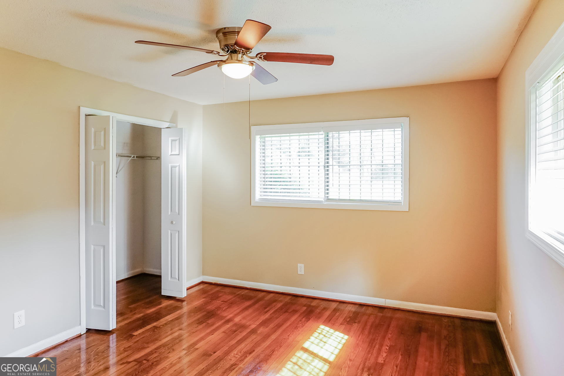 3762 Elkridge Drive Decatur, GA 30032 - Photo 8 of 16 a view of an empty room with wooden floor and a window