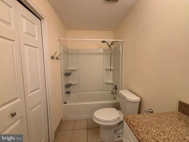 a bathroom with a toilet and shower