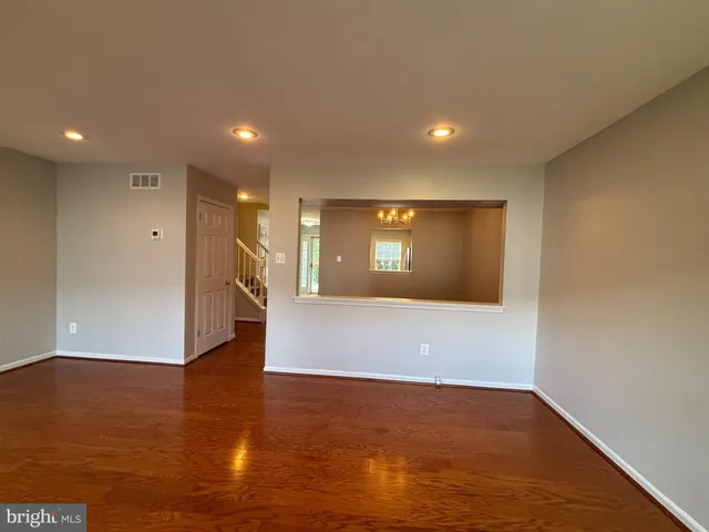 a view of livingroom with hardwood floor and kitchen