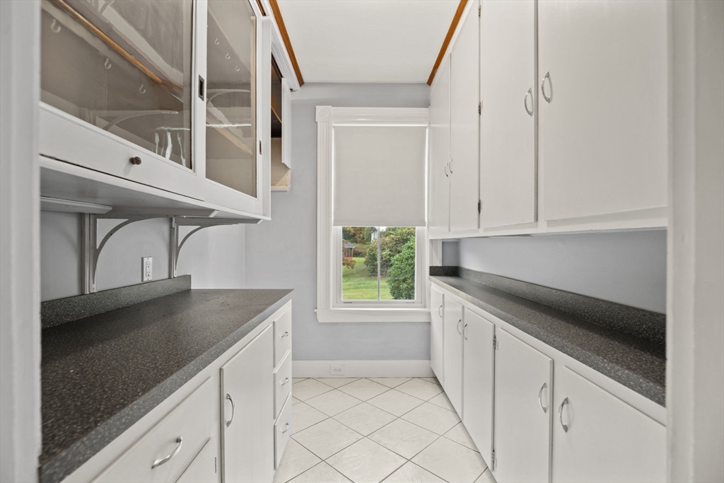 46 South Hampton Road Amesbury, MA 01913 - Photo 11 of 42 a kitchen with stainless steel appliances granite countertop a sink and a cabinets