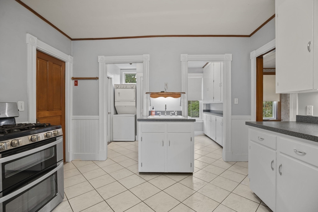 46 South Hampton Road Amesbury, MA 01913 - Photo 12 of 42 a kitchen with white cabinets and stainless steel appliances