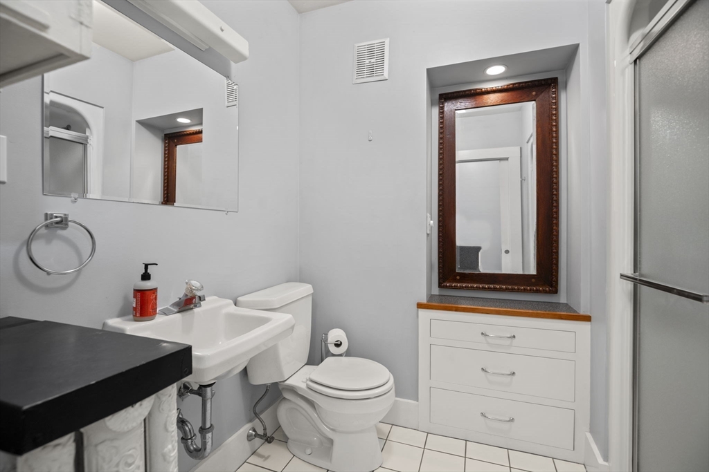 46 South Hampton Road Amesbury, MA 01913 - Photo 16 of 42 a bathroom with a sink vanity mirror and toilet