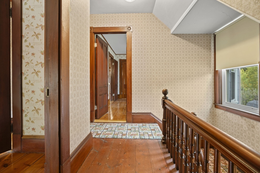 46 South Hampton Road Amesbury, MA 01913 - Photo 21 of 42 a view of a hallway with wooden floor and dining room view