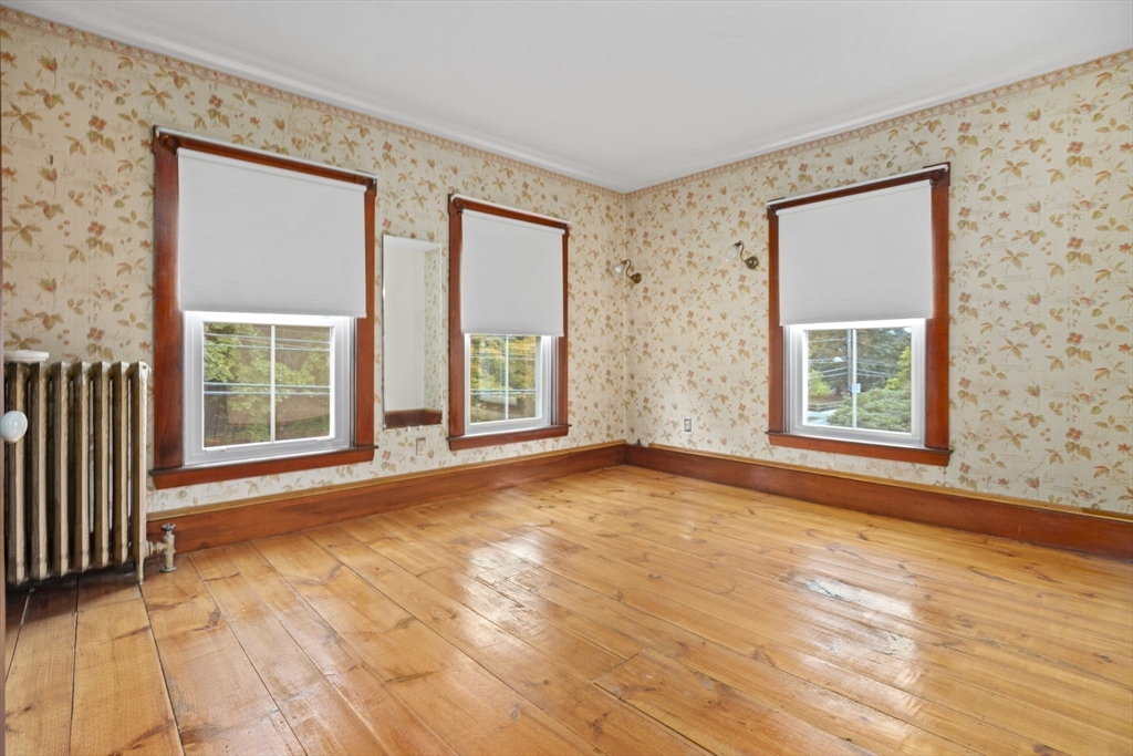 46 South Hampton Road Amesbury, MA 01913 - Photo 22 of 42 a view of an empty room with a window and wooden floor