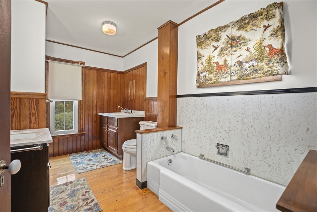 46 South Hampton Road Amesbury, MA 01913 - Photo 29 of 42 a bathroom with a bathtub sink and mirror