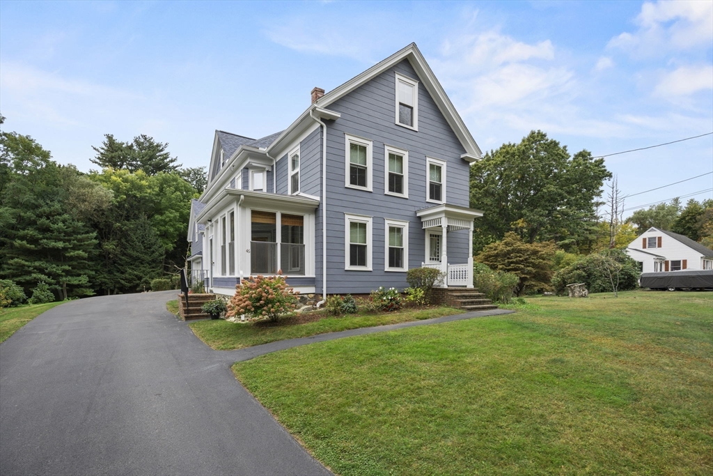 46 South Hampton Road Amesbury, MA 01913 - Photo 3 of 42 a front view of a house with a garden