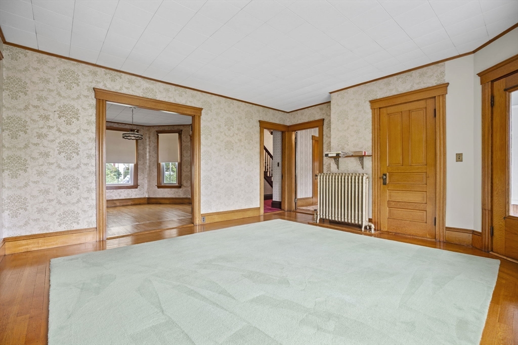 46 South Hampton Road Amesbury, MA 01913 - Photo 7 of 42 a view of an empty room with window and stairs