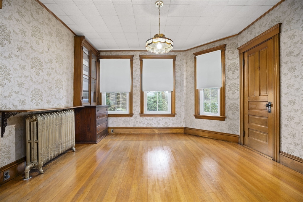 46 South Hampton Road Amesbury, MA 01913 - Photo 9 of 42 a view of an empty room with wooden floor and a window