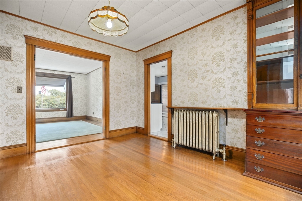 46 South Hampton Road Amesbury, MA 01913 - Photo 10 of 42 a view of a hallway with wooden floor and door