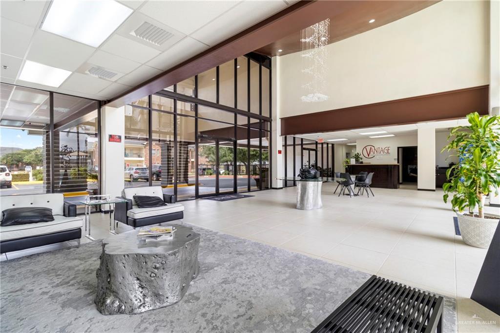 813 Travis Street, Unit 315 Mission, TX 78572 - Photo 3 of 25 a view of a lobby with furniture and floor to ceiling window