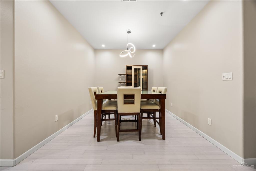813 Travis Street, Unit 315 Mission, TX 78572 - Photo 10 of 25 a dining room with furniture and window