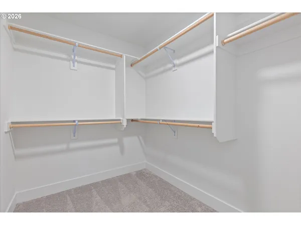 a view of an empty walk in closet