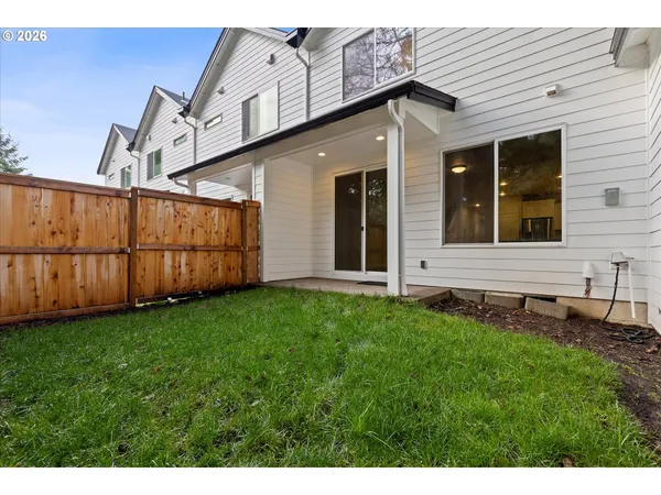 a view of a back yard of the house