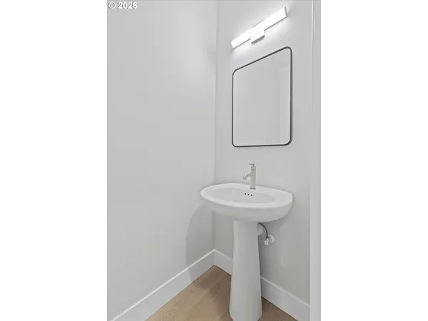 a bathroom with a sink a mirror and shower