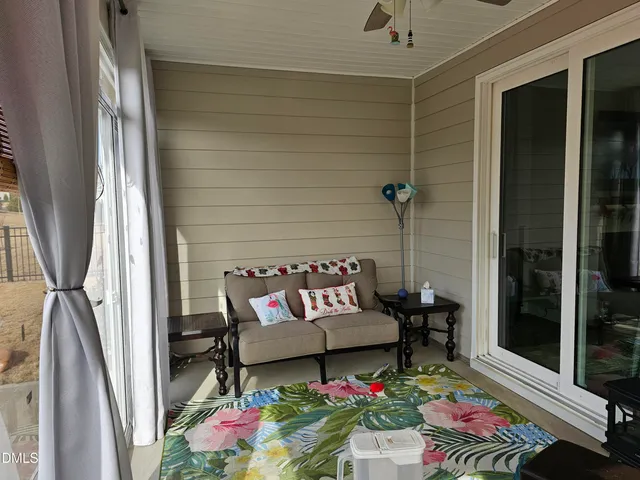 a street sign on a wall next to a road