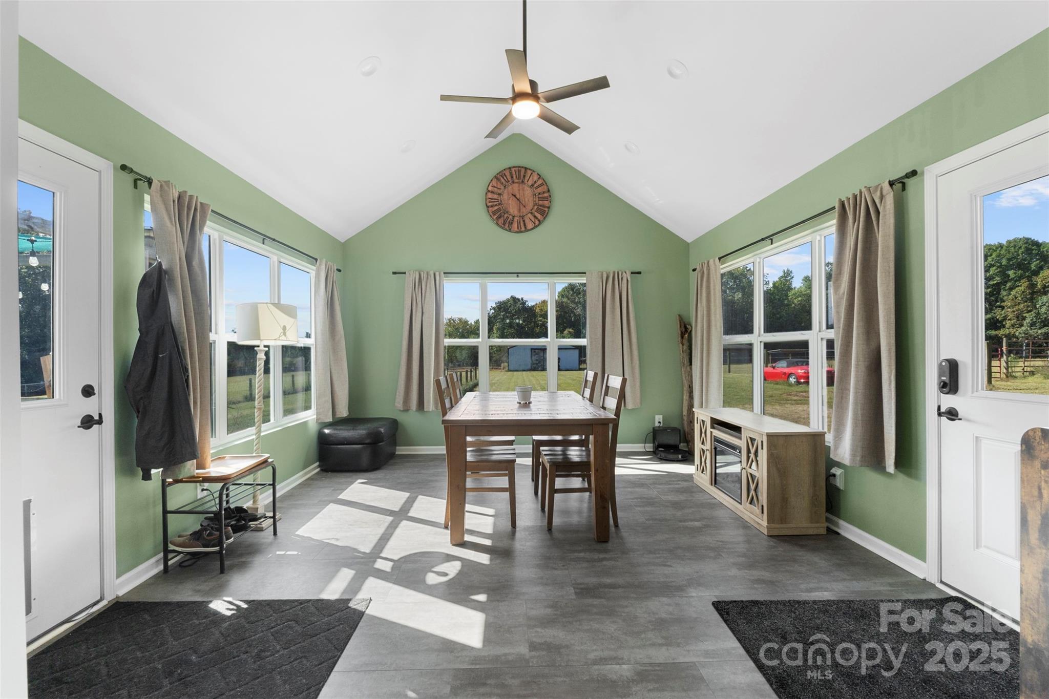 6601 Love Point Road Denver, NC 28037 - Photo 11 of 36 a dining room with furniture wooden floor a chandelier