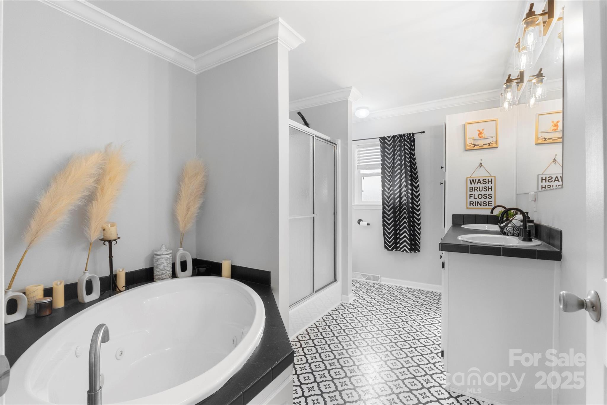 6601 Love Point Road Denver, NC 28037 - Photo 15 of 36 a bathroom with a bathtub and a sink