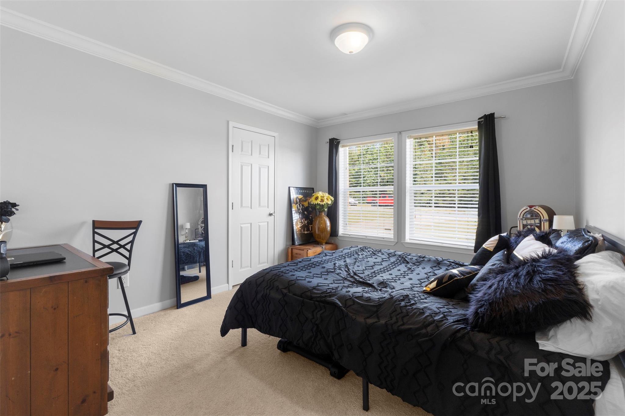 6601 Love Point Road Denver, NC 28037 - Photo 19 of 36 a bed sitting in a bedroom next to a window