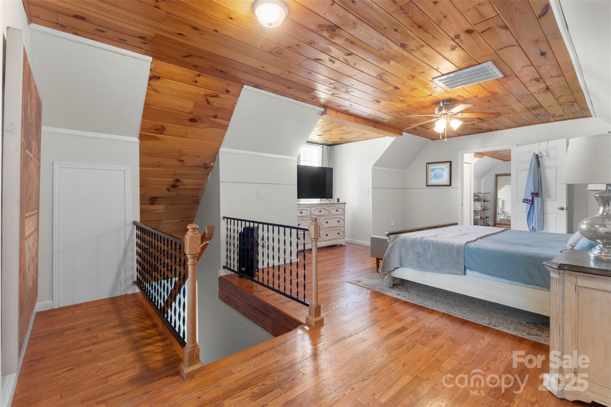 6601 Love Point Road Denver, NC 28037 - Photo 20 of 36 a bedroom with furniture and a wooden floor