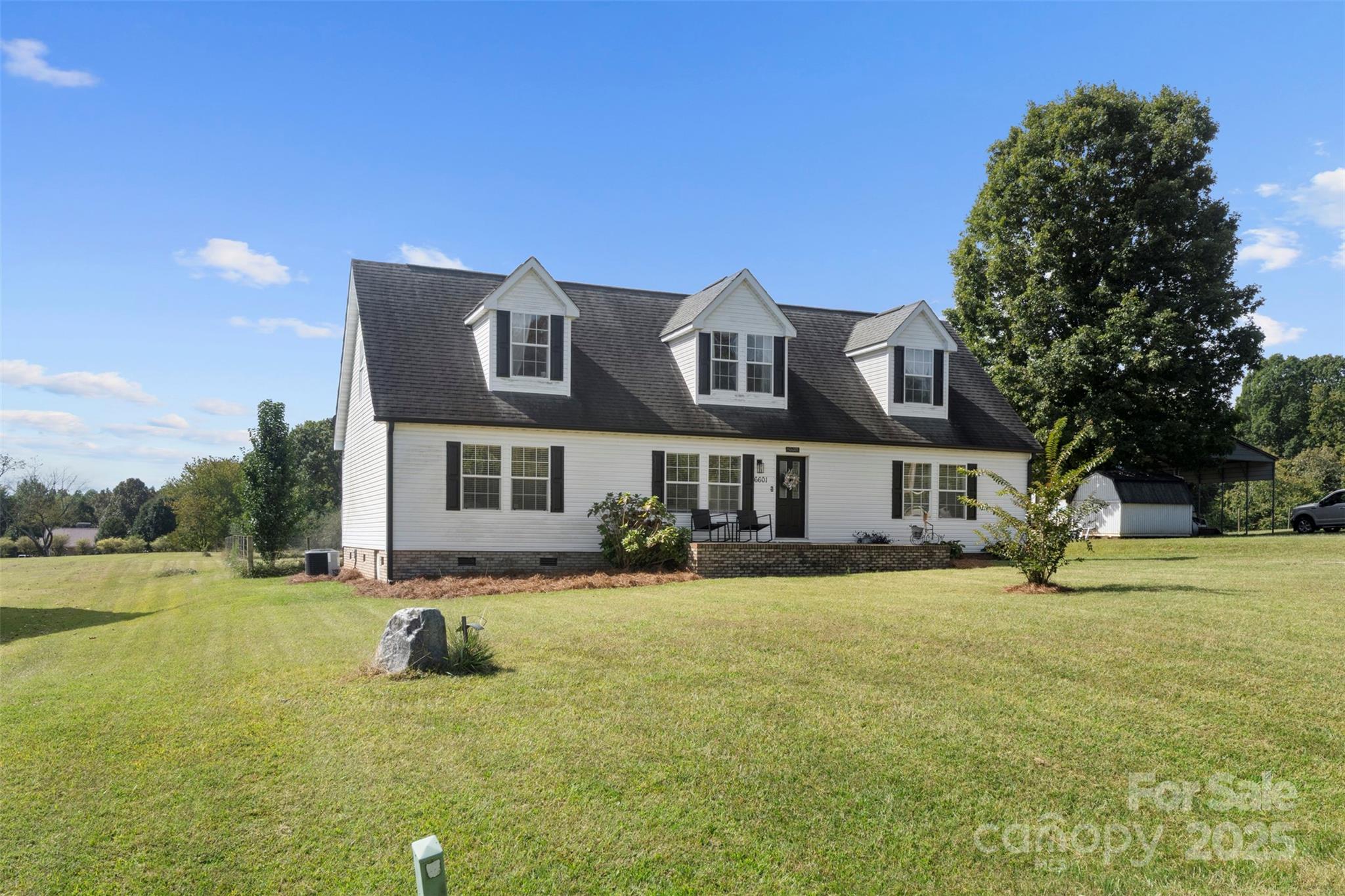 6601 Love Point Road Denver, NC 28037 - Photo 2 of 36 a view of a house with a big yard and large trees