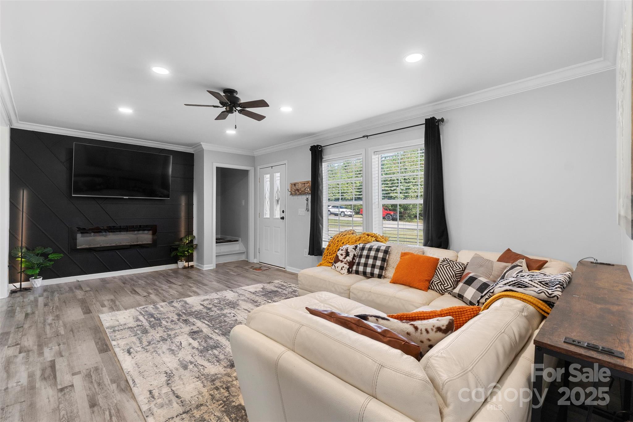 6601 Love Point Road Denver, NC 28037 - Photo 5 of 36 a bedroom with furniture and a flat screen tv