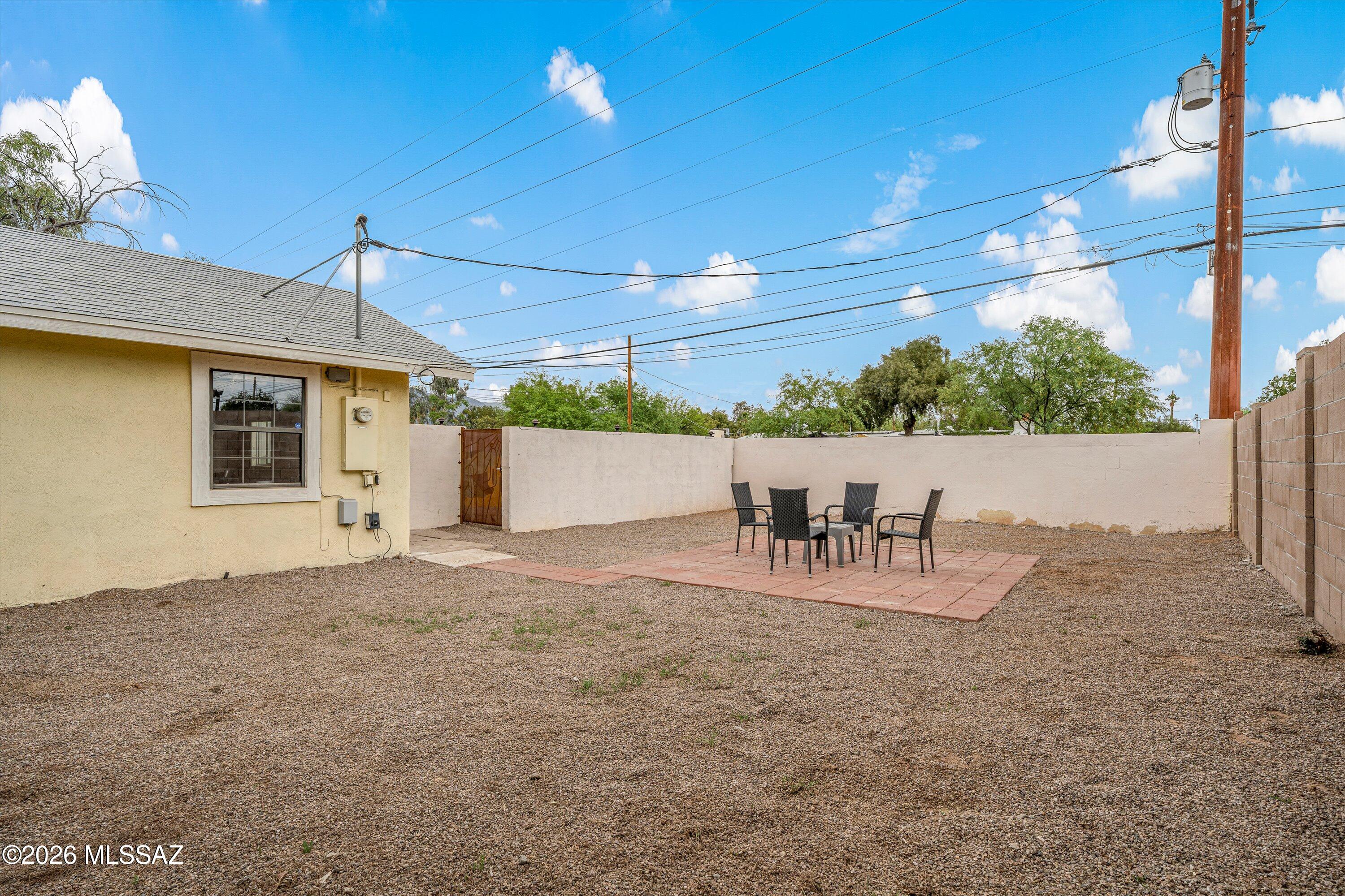 2841 North Richey Boulevard Tucson, AZ 85716 - Photo 5 of 30 a view of a patio with a table and chairs