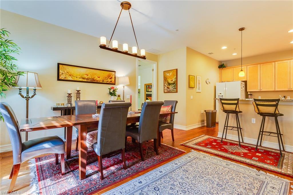 9088 Chula Vista Street, Unit 1083 Naples, FL 34113 - Photo 8 of 31 a view of a dining room with furniture