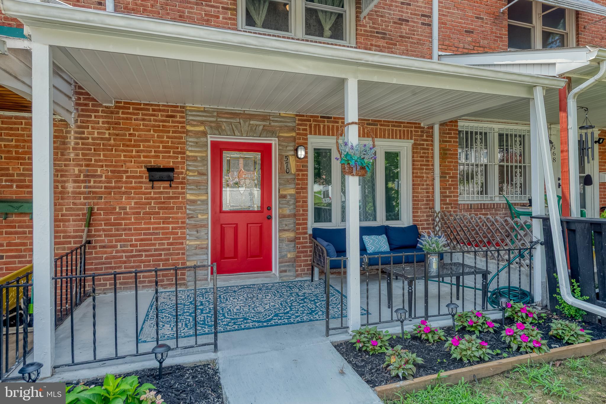 570 47th Street Baltimore, MD 21224 - Photo 2 of 41 a view of a house with potted plants