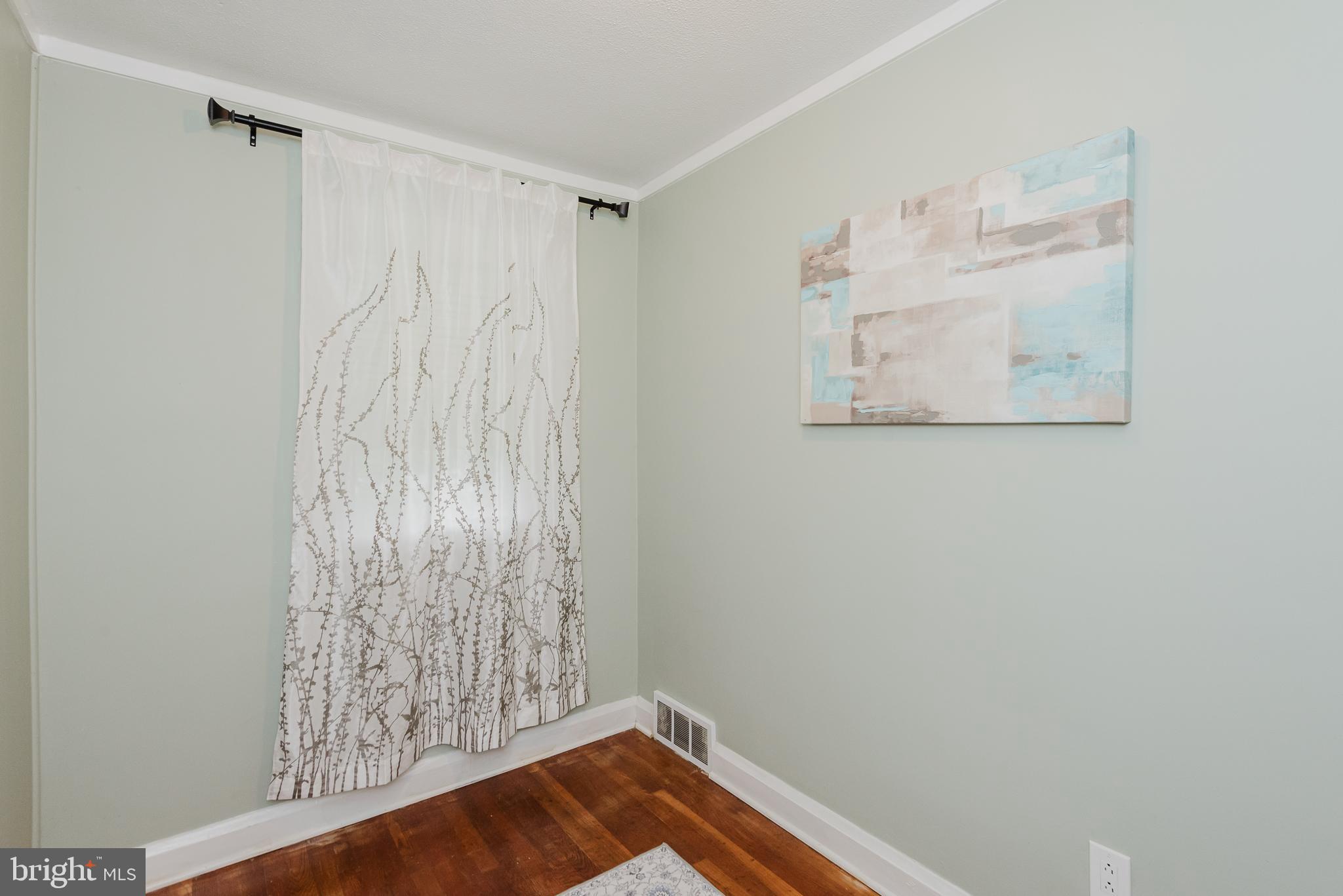 570 47th Street Baltimore, MD 21224 - Photo 25 of 41 a view of small space with wooden floor and fan