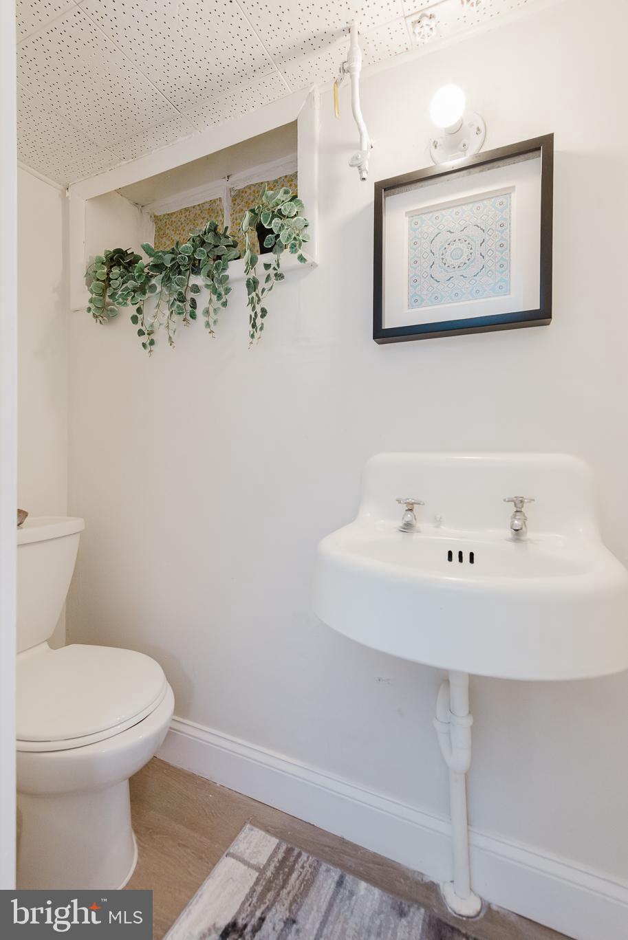 570 47th Street Baltimore, MD 21224 - Photo 33 of 41 a bathroom with a toilet and a bathtub