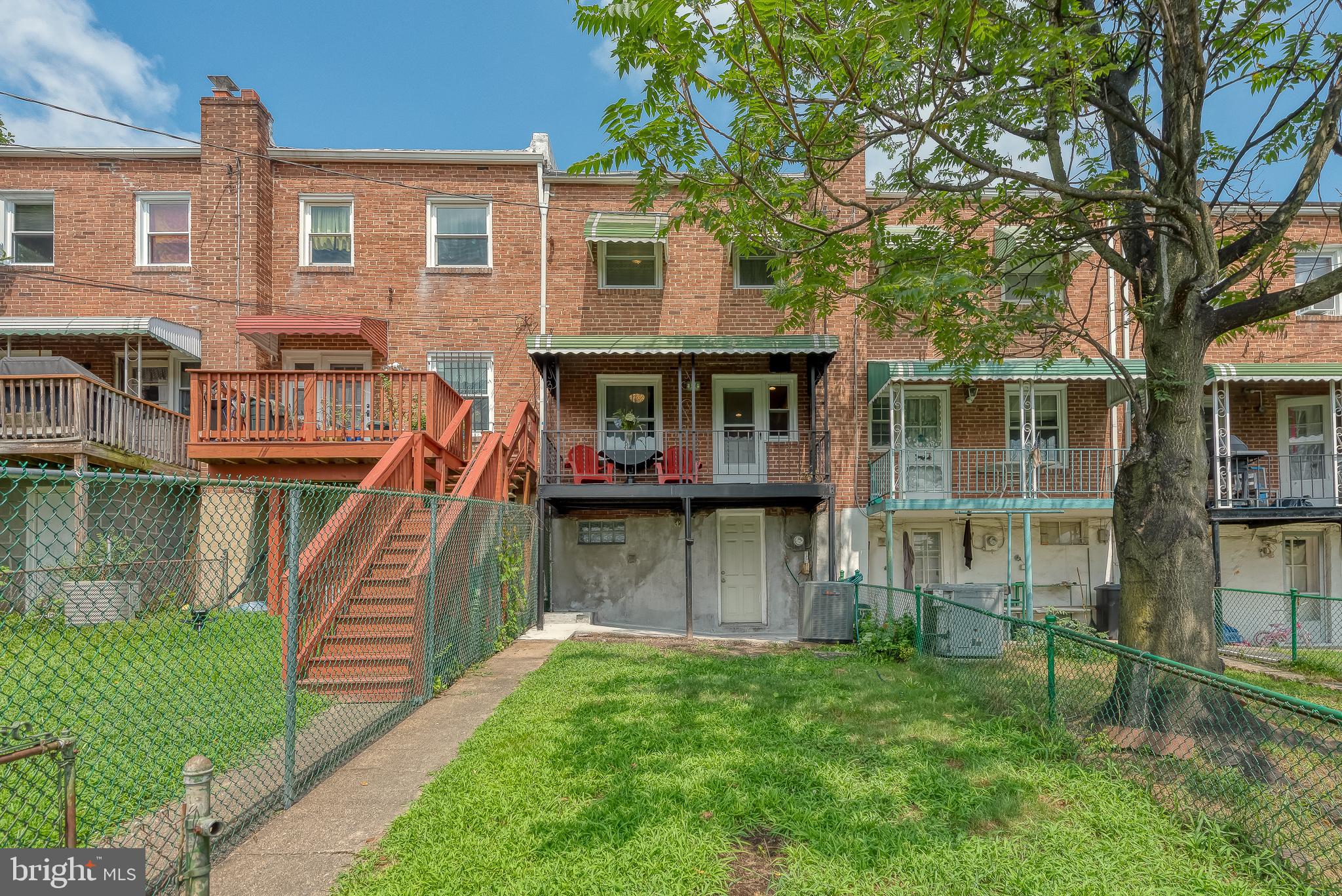 570 47th Street Baltimore, MD 21224 - Photo 41 of 41 a front view of a house with a yard table and chairs