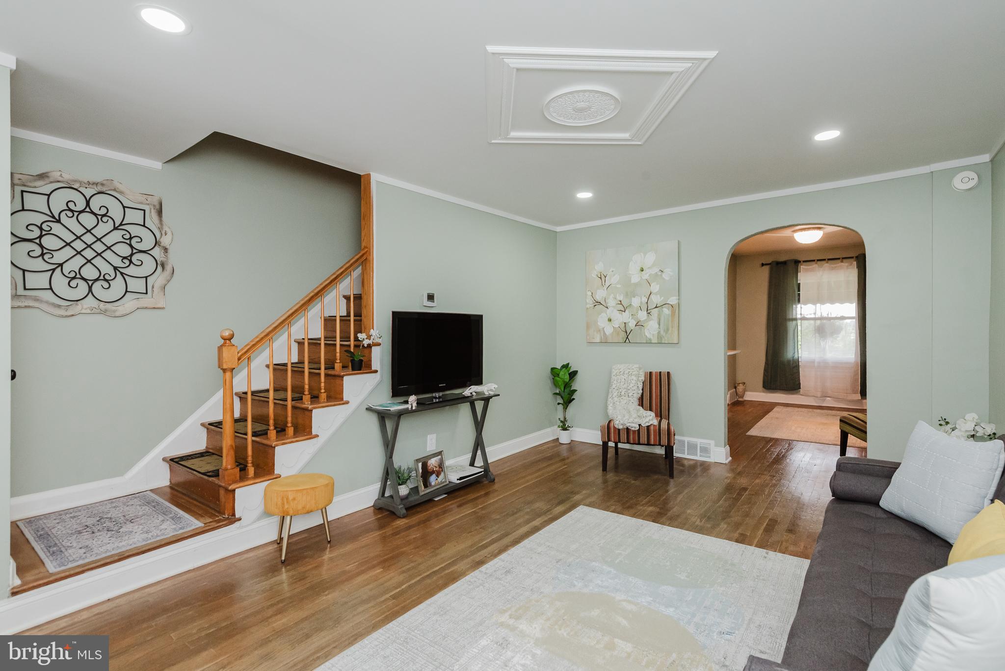 570 47th Street Baltimore, MD 21224 - Photo 6 of 41 a living room with furniture and a flat screen tv