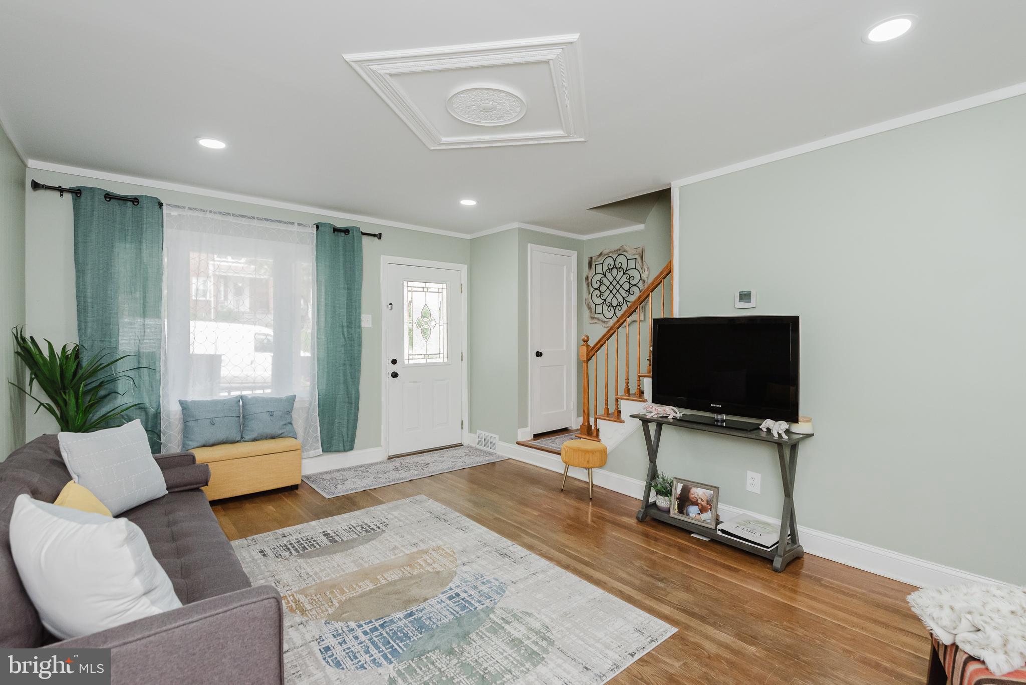 570 47th Street Baltimore, MD 21224 - Photo 7 of 41 a living room with furniture and a flat screen tv