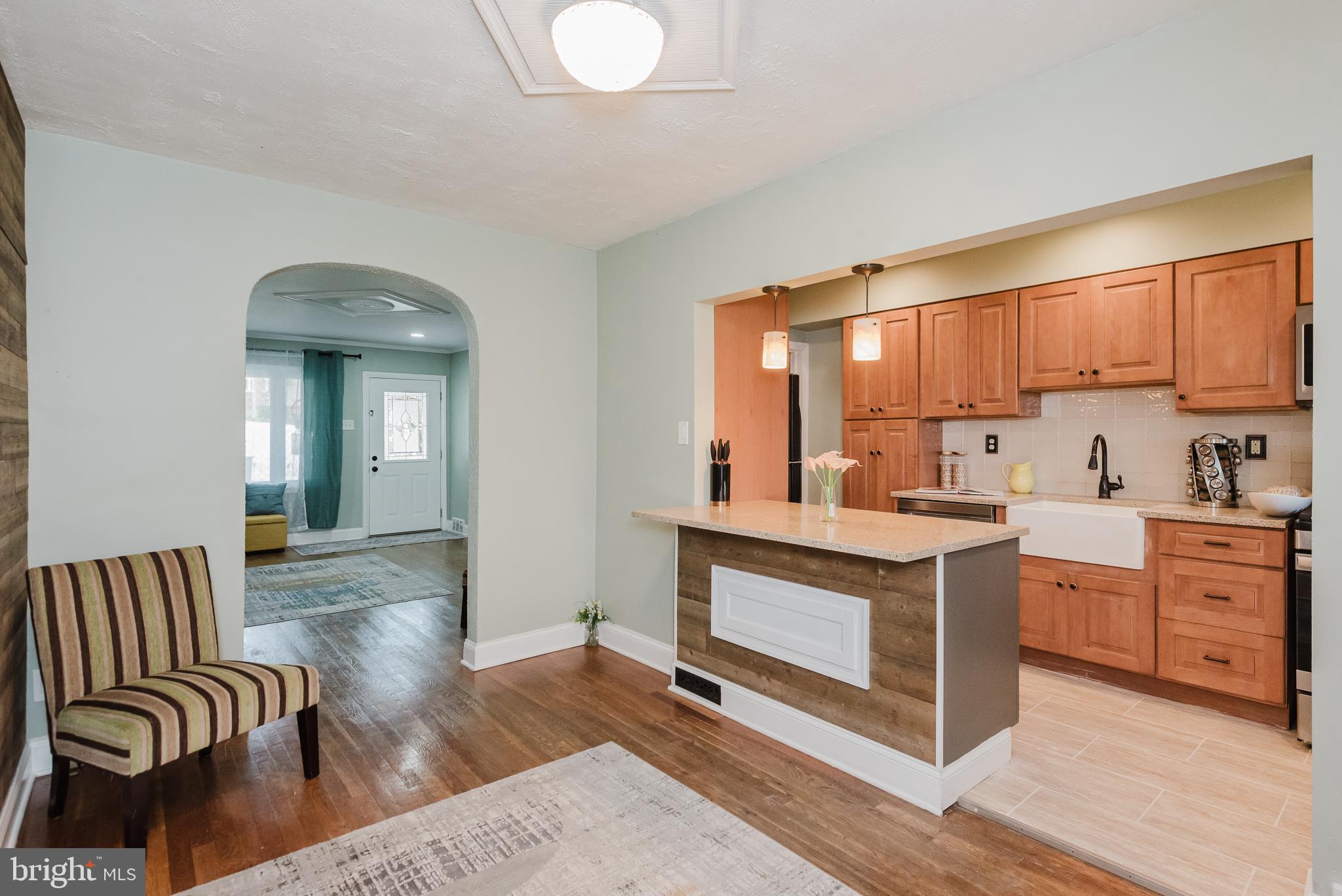 570 47th Street Baltimore, MD 21224 - Photo 10 of 41 a view of living room with granite countertop furniture and fireplace