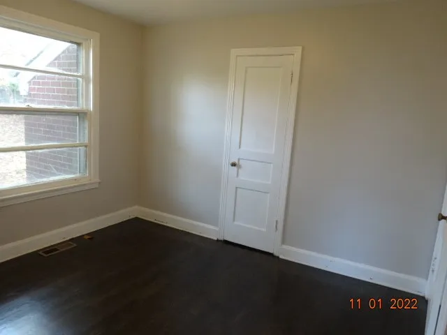 a view of an empty room and window