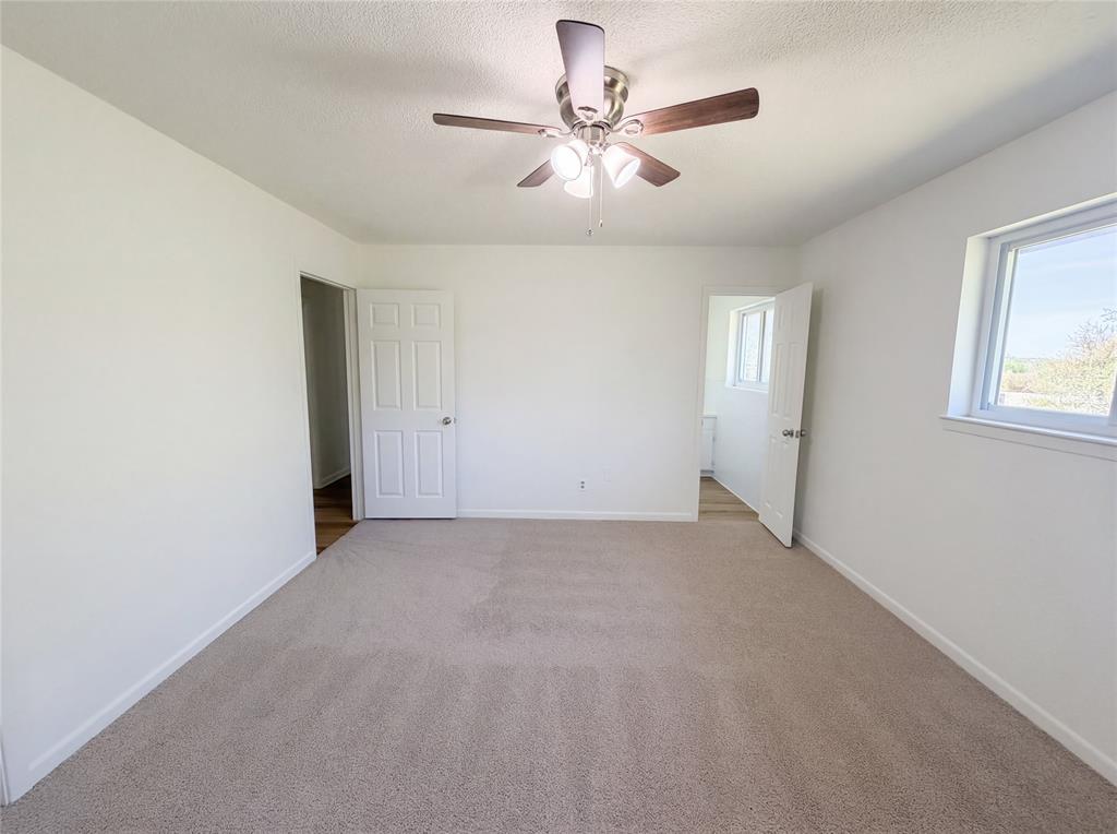 607 State Street Weatherford, TX 76086 - Photo 14 of 16 a view of an empty room with a window
