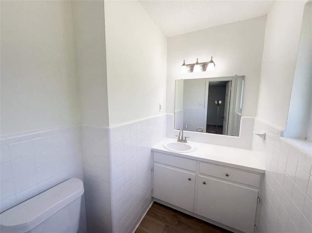 607 State Street Weatherford, TX 76086 - Photo 15 of 16 a bathroom with a sink and a toilet