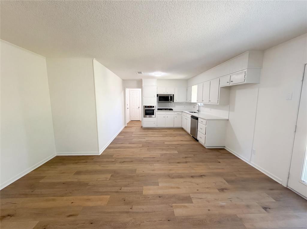607 State Street Weatherford, TX 76086 - Photo 8 of 16 a view of a kitchen with a sink