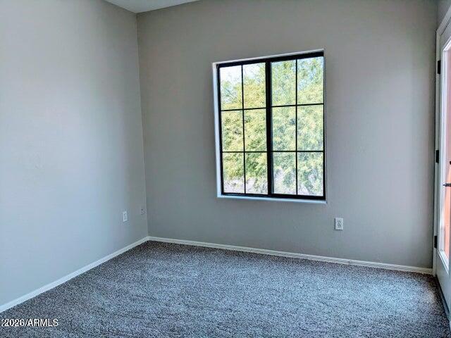 3150 East Beardsley Road, Unit 1045 Phoenix, AZ 85050 - Photo 14 of 23 an empty room with a window