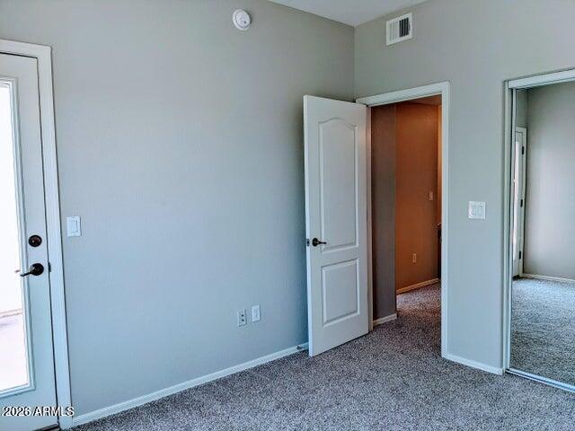 3150 East Beardsley Road, Unit 1045 Phoenix, AZ 85050 - Photo 15 of 23 an empty room with windows and closet