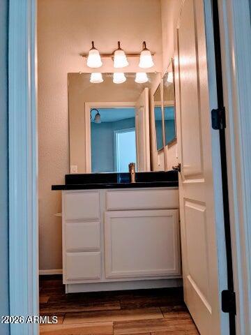 3150 East Beardsley Road, Unit 1045 Phoenix, AZ 85050 - Photo 17 of 23 a bathroom with a sink and a mirror