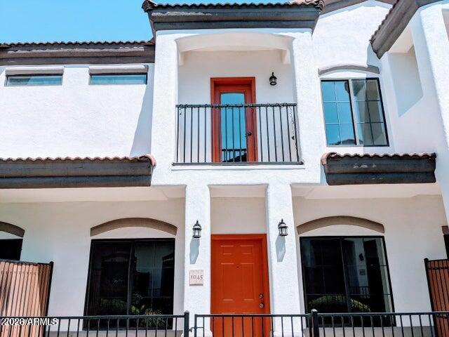 3150 East Beardsley Road, Unit 1045 Phoenix, AZ 85050 - Photo 2 of 23 a front view of a house with entryway