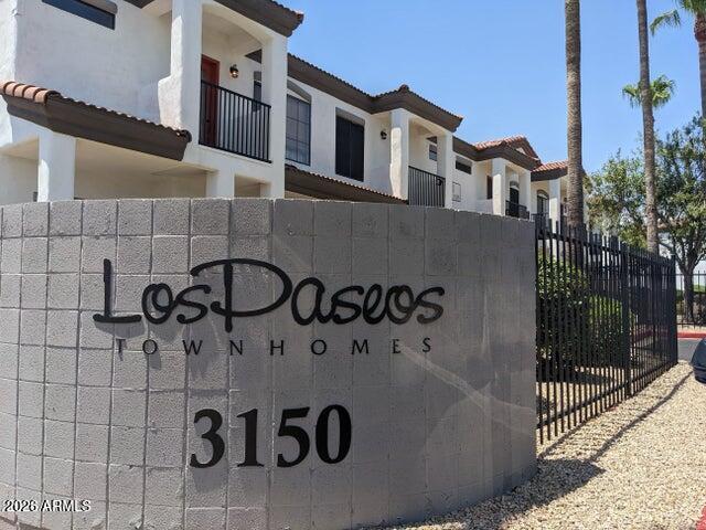 3150 East Beardsley Road, Unit 1045 Phoenix, AZ 85050 - Photo 22 of 23 a front view of a house with parking area