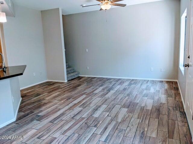 3150 East Beardsley Road, Unit 1045 Phoenix, AZ 85050 - Photo 6 of 23 a view of a room with wooden floor