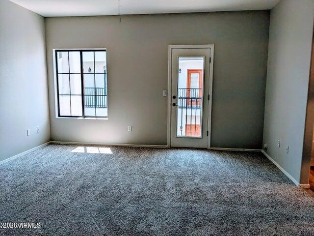 3150 East Beardsley Road, Unit 1045 Phoenix, AZ 85050 - Photo 8 of 23 an empty room with windows