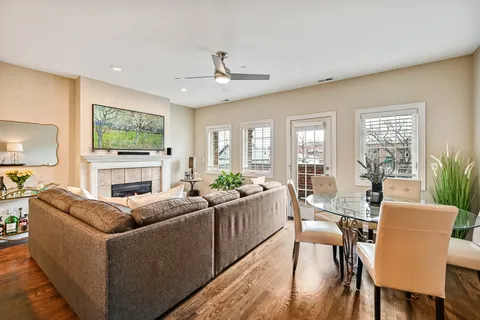 a living room with fireplace furniture and a flat screen tv